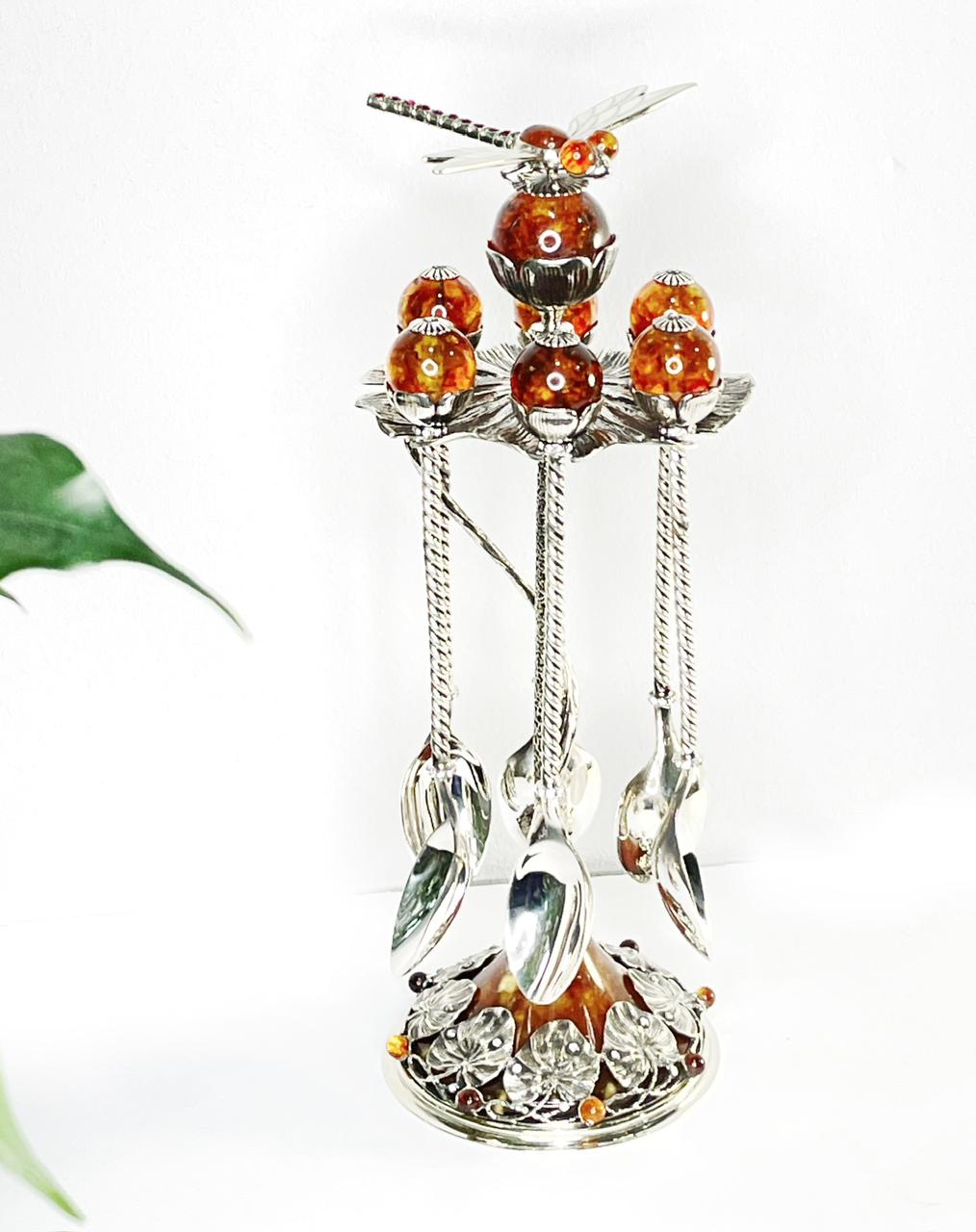 Collectible silver spoon set decorated with amber